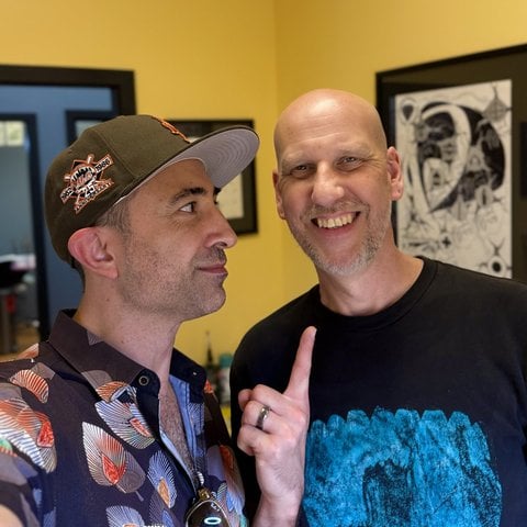 Tim with the owner of Blackfang Tattoos and More inside the shop